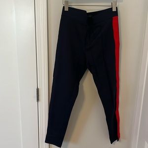 Ann Taylor navy with red striped going down the sides leggings in size Medium